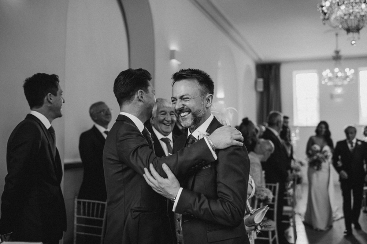 groom laughing during ceremony iscoyd park