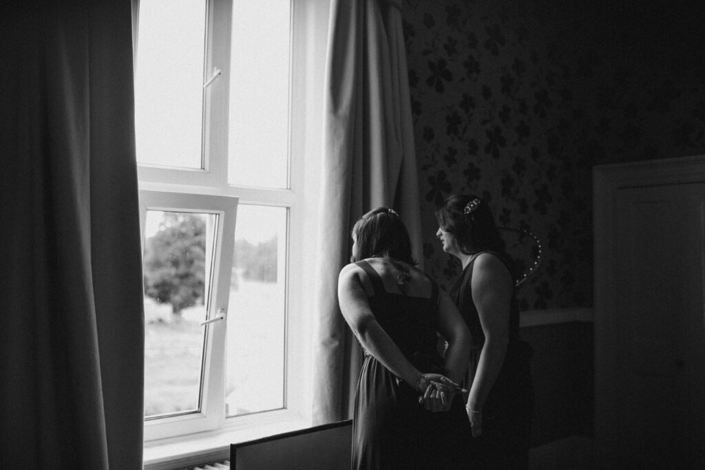 bridesmaids looking out of the window at the wroxeter