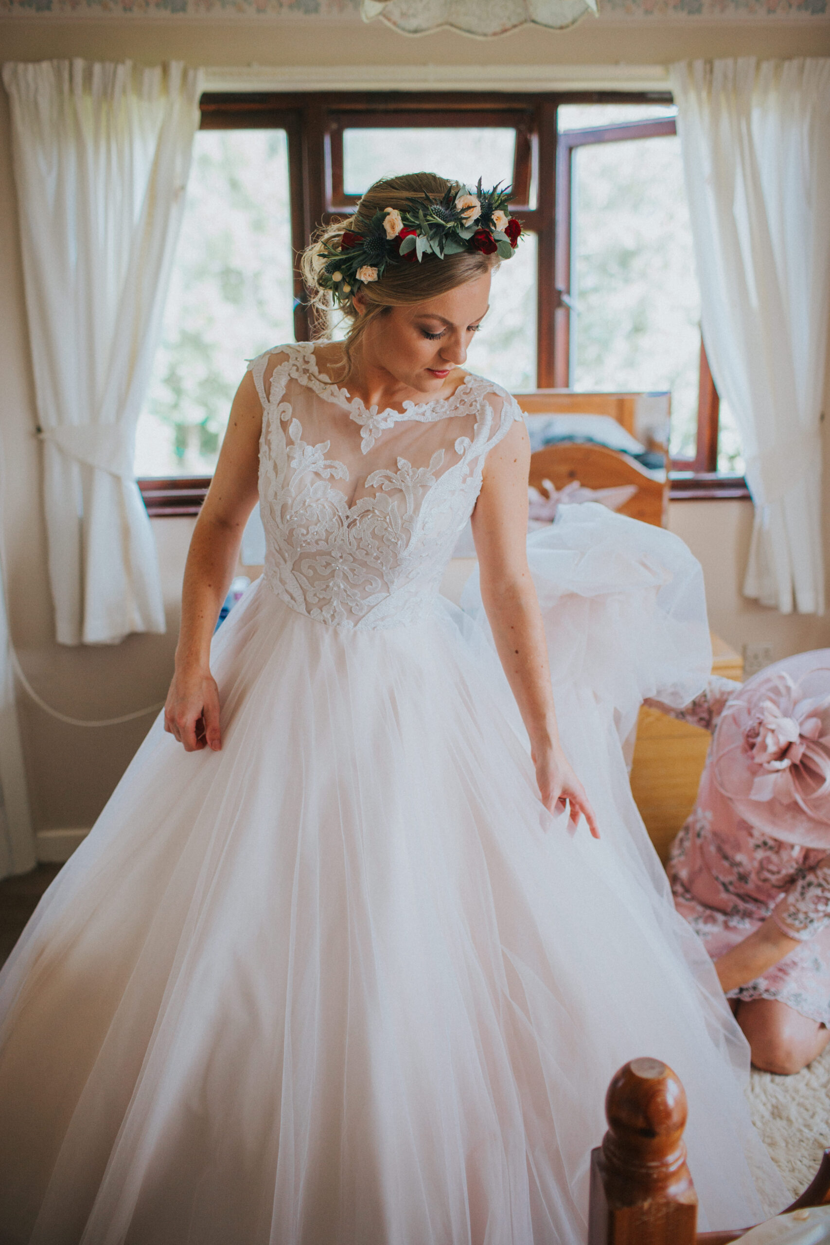 bride in wedding dress at home