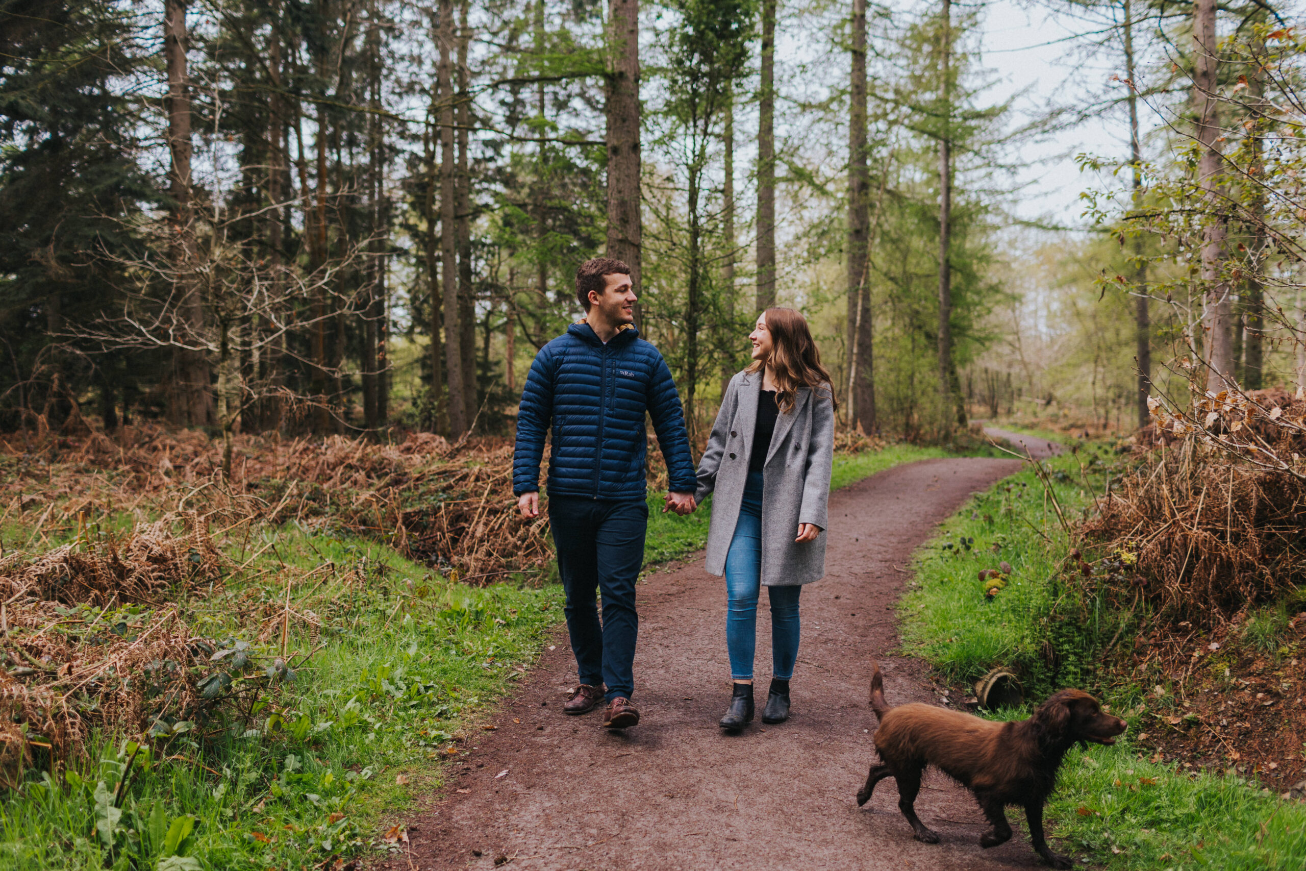 Happy couple smiling during their engagement shoot