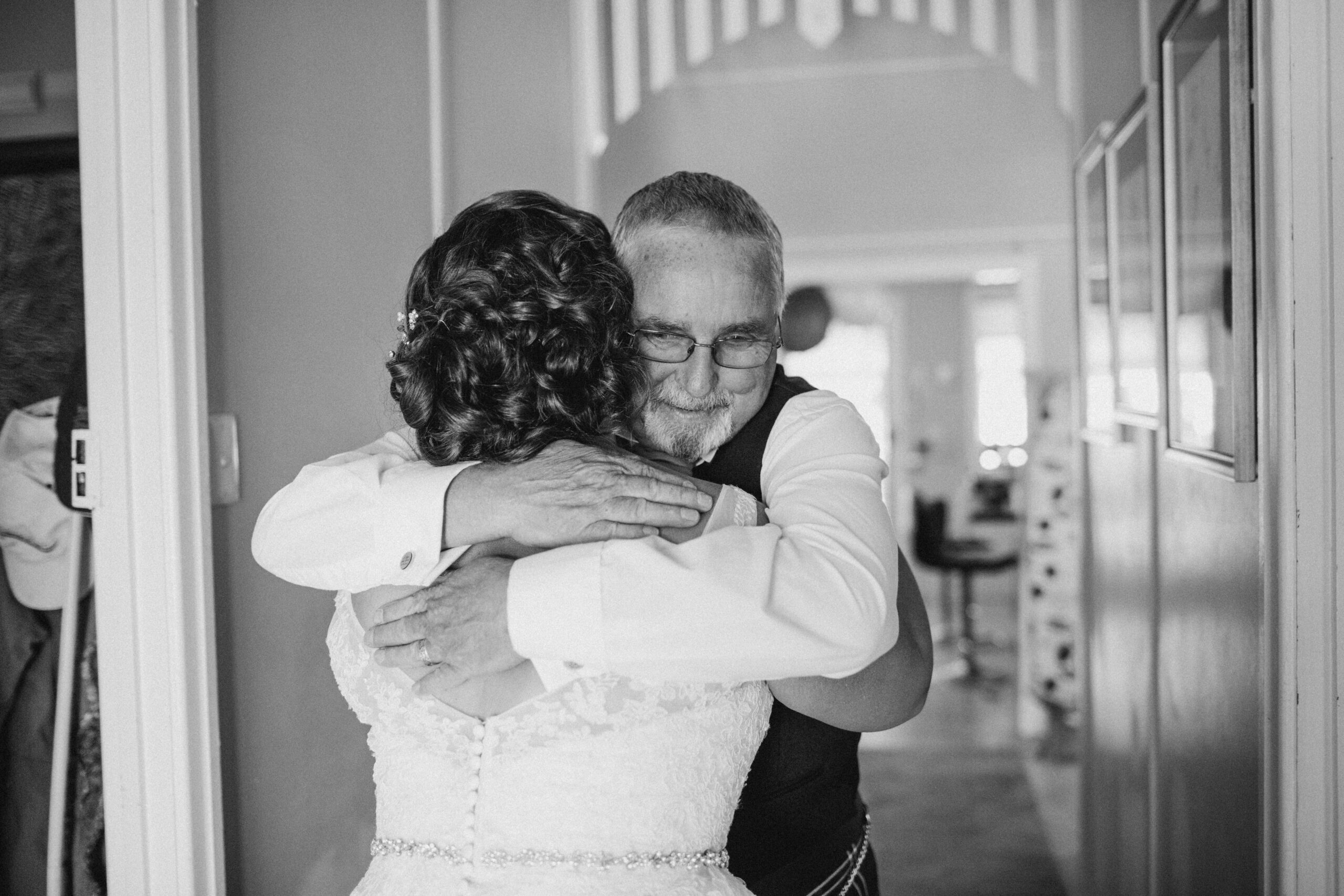 dad hugging bride