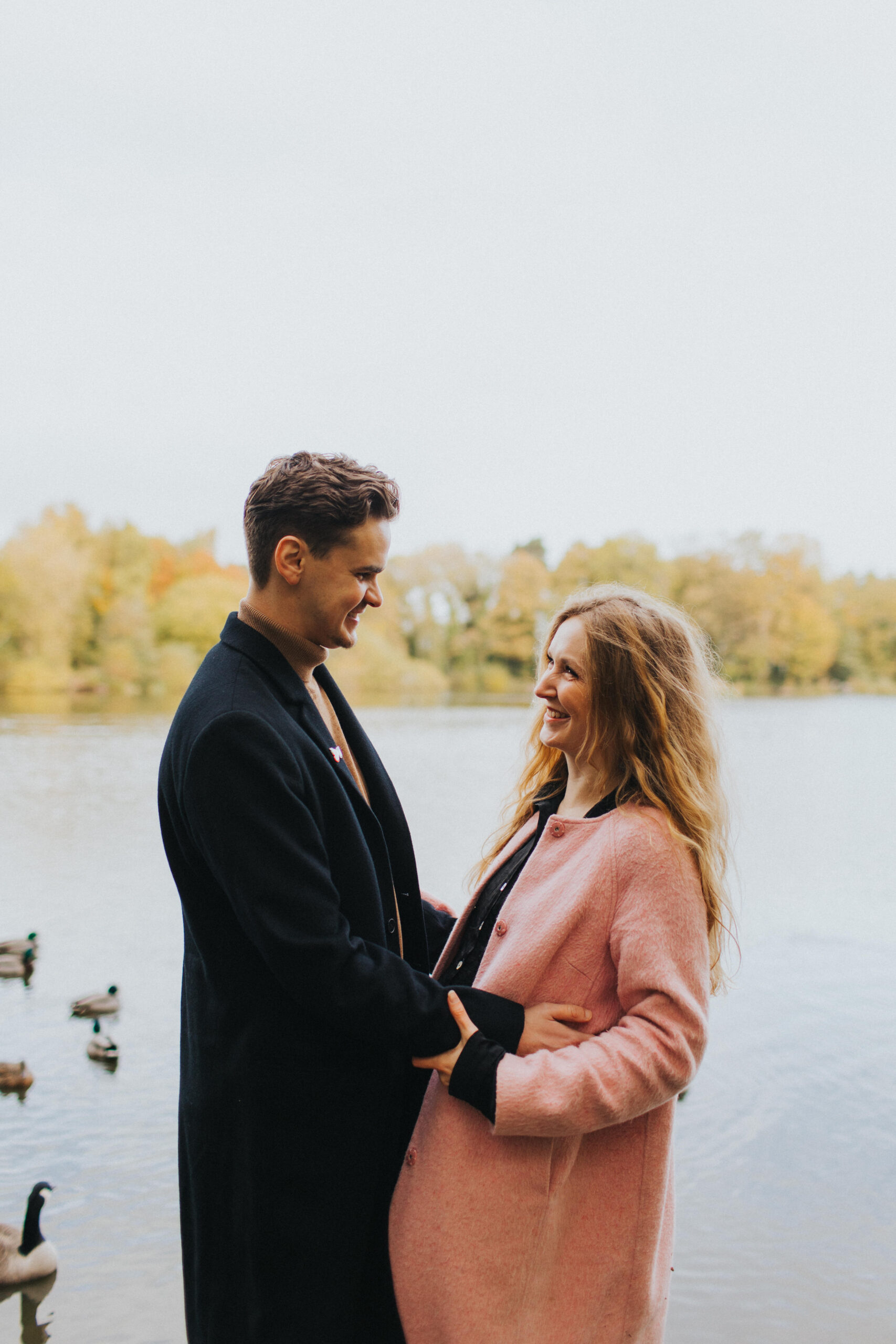 Couple enjoys a candid moment together, captured during their shoot