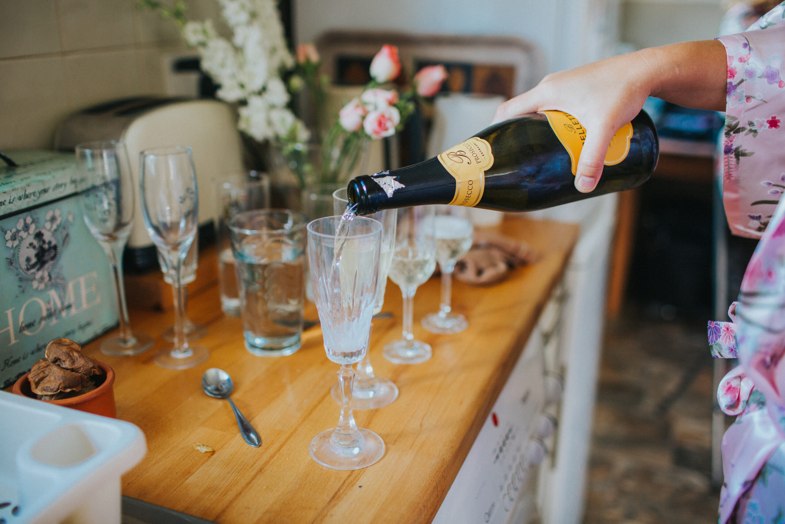 prosecco being poured ahead of the wedding
