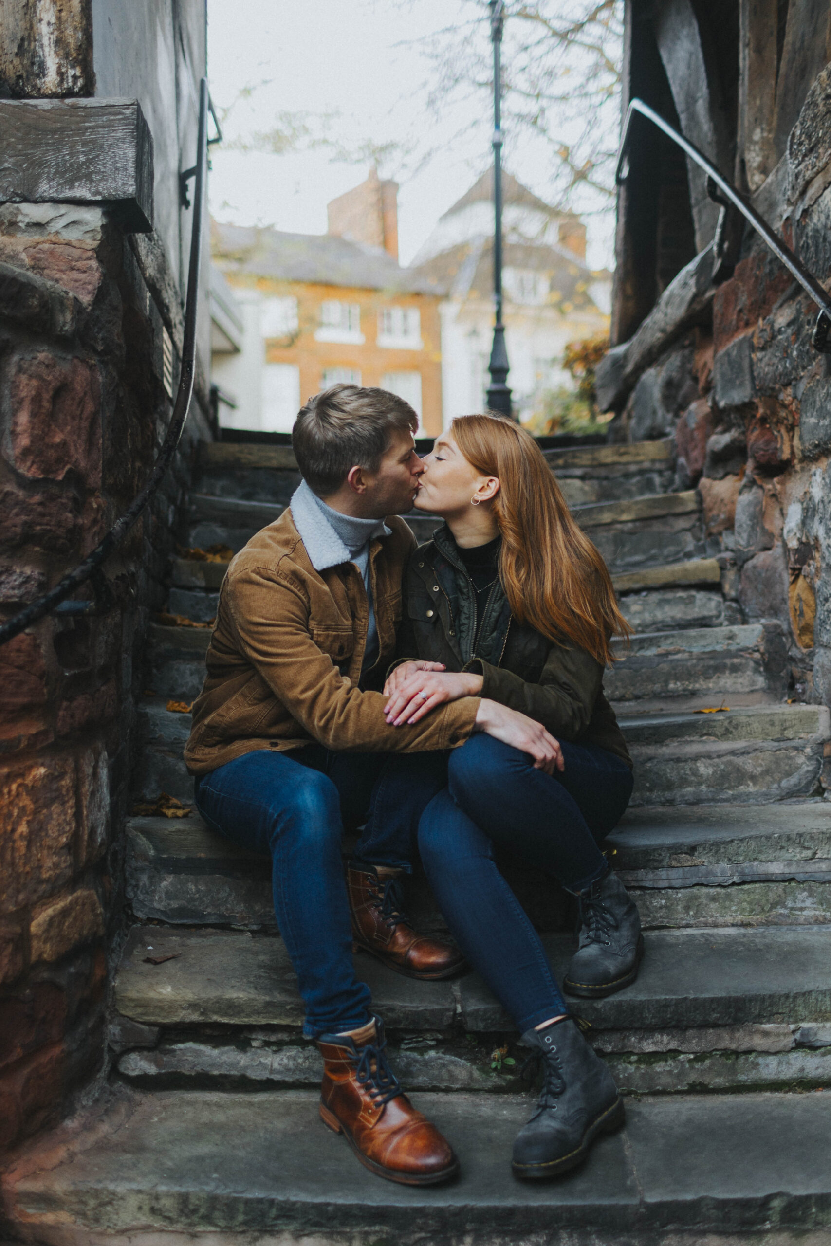 Couple poses playfully during their engagement session