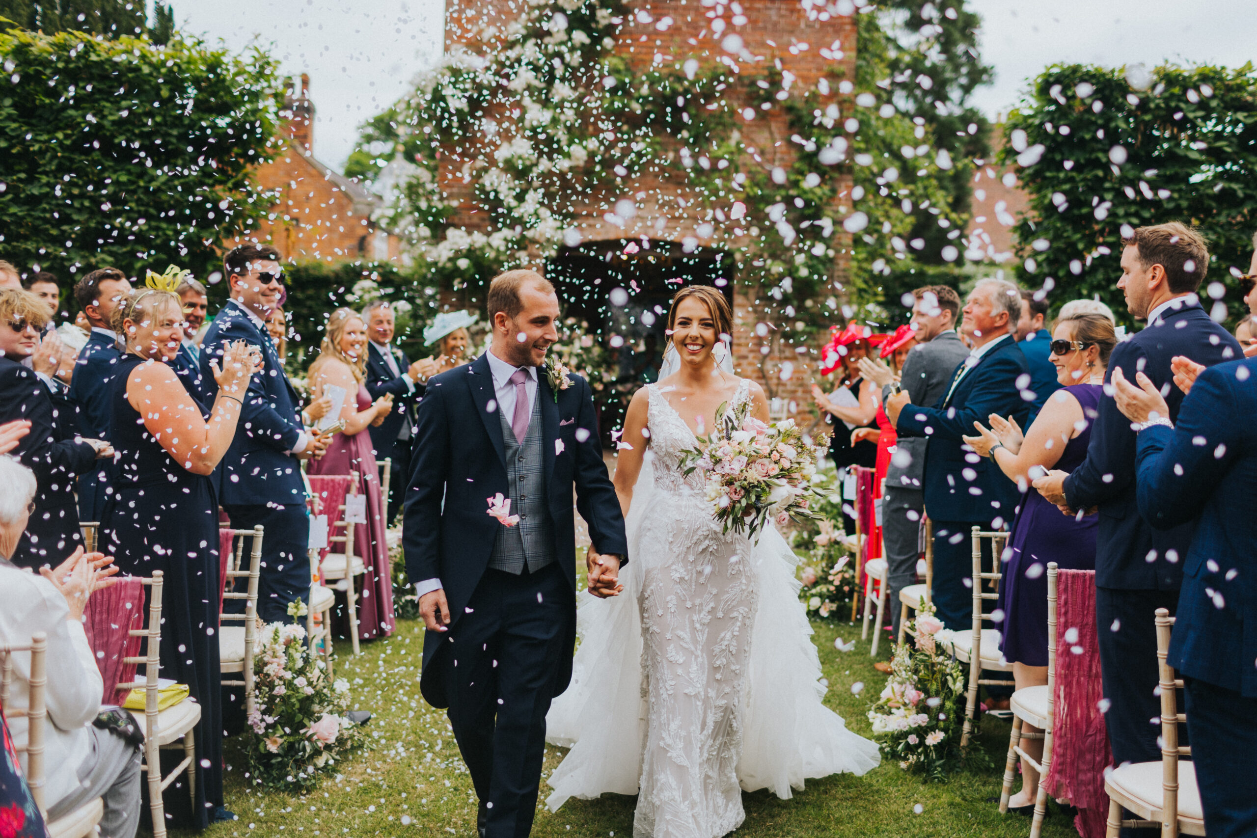 Bride's laughter echoes amidst the confetti shower