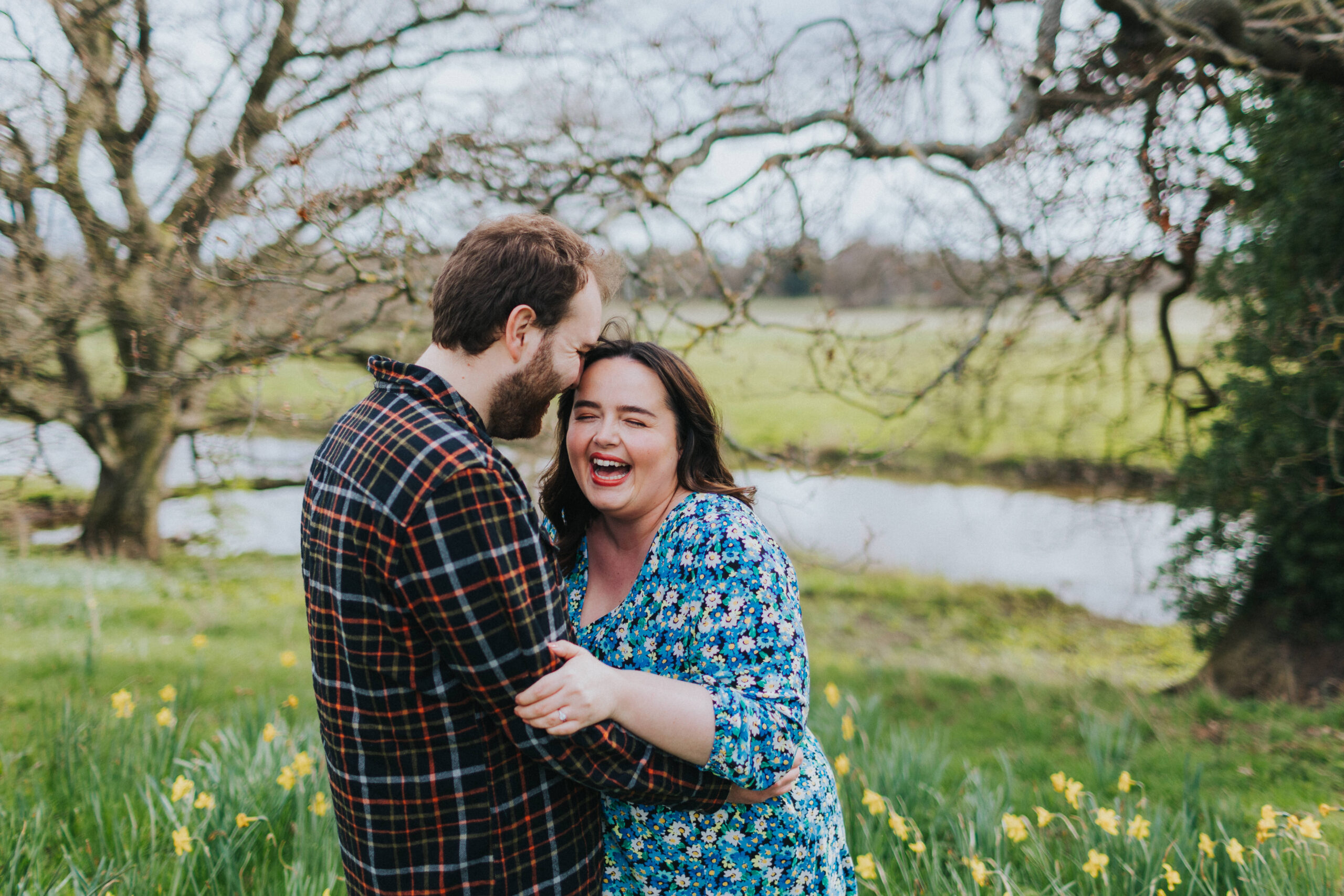 Couple laughing together during their engagement session