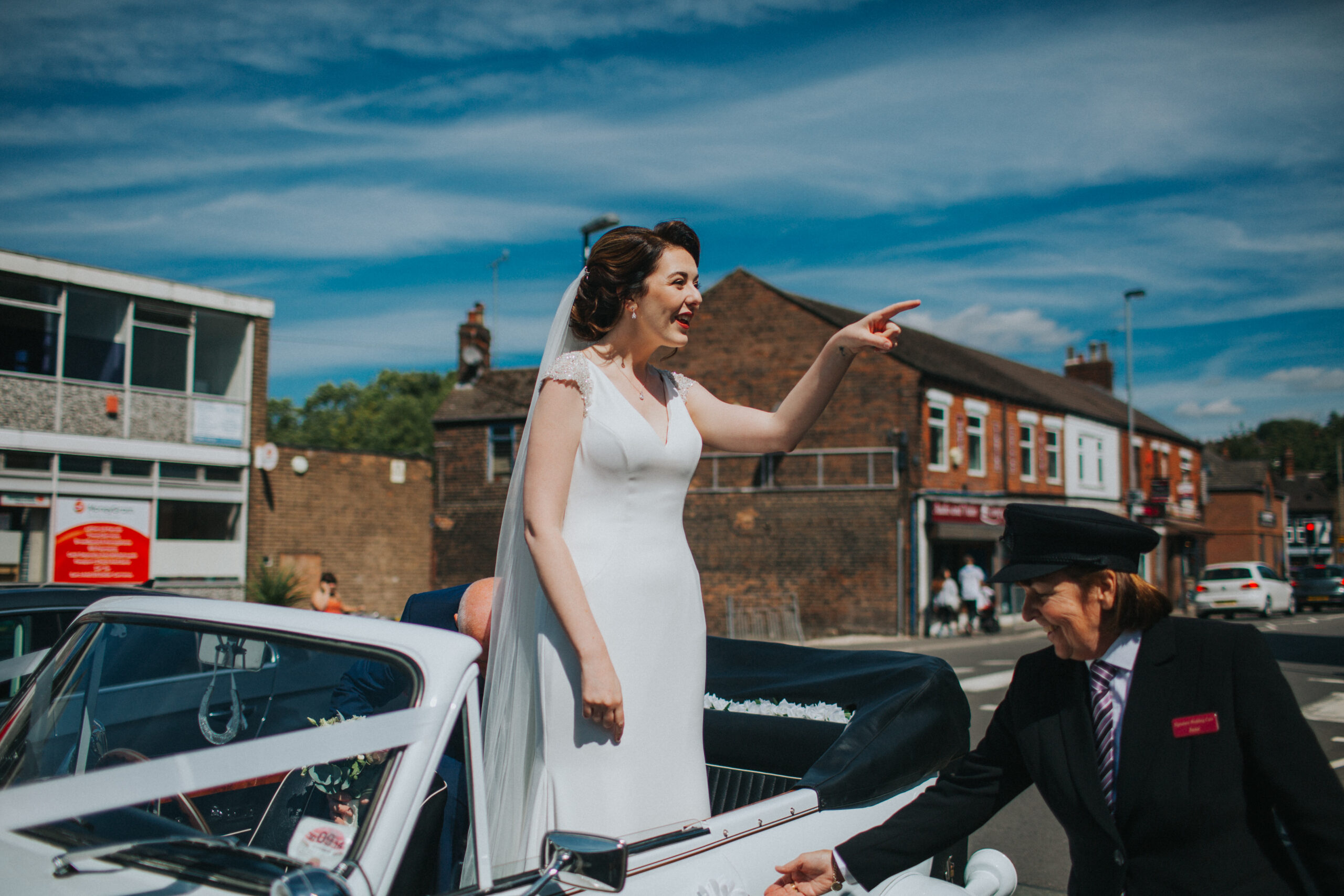 bride arriving at church in classic car