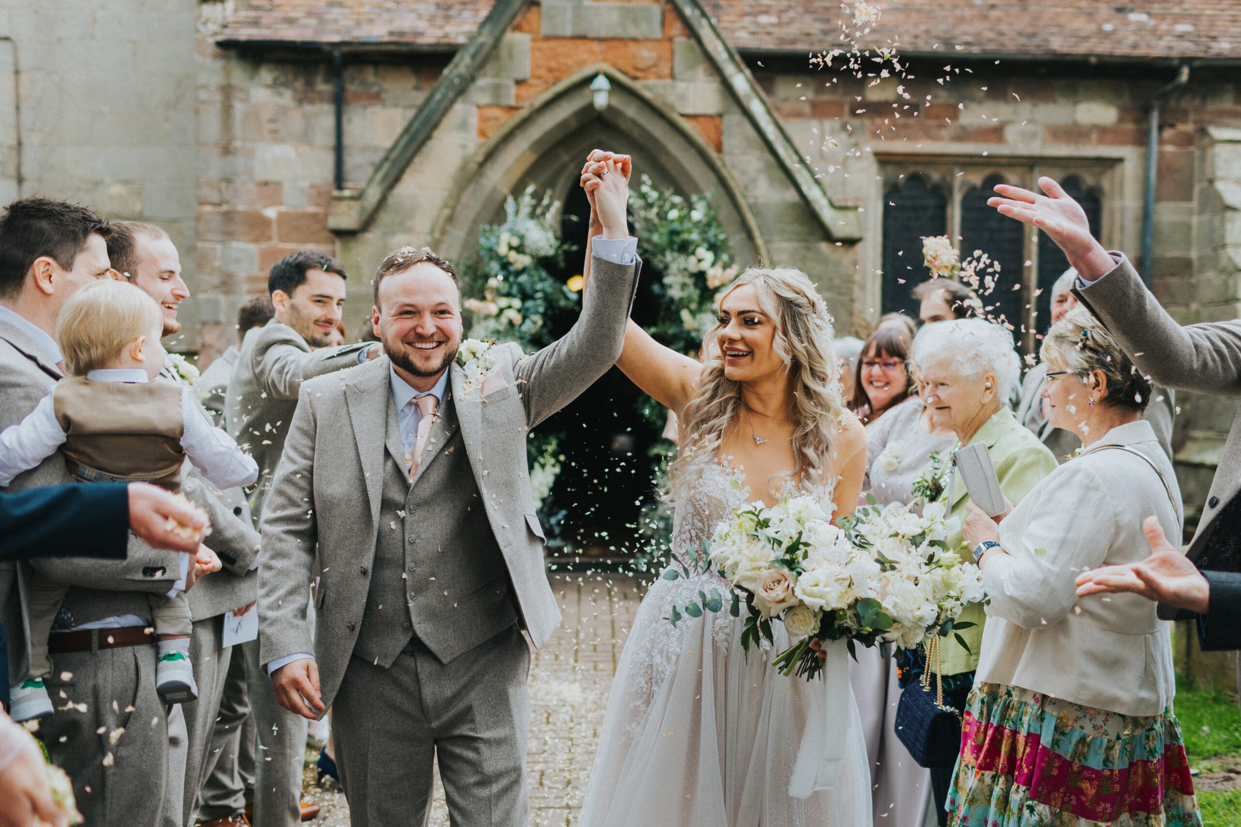 Playful interaction between the couple and confetti