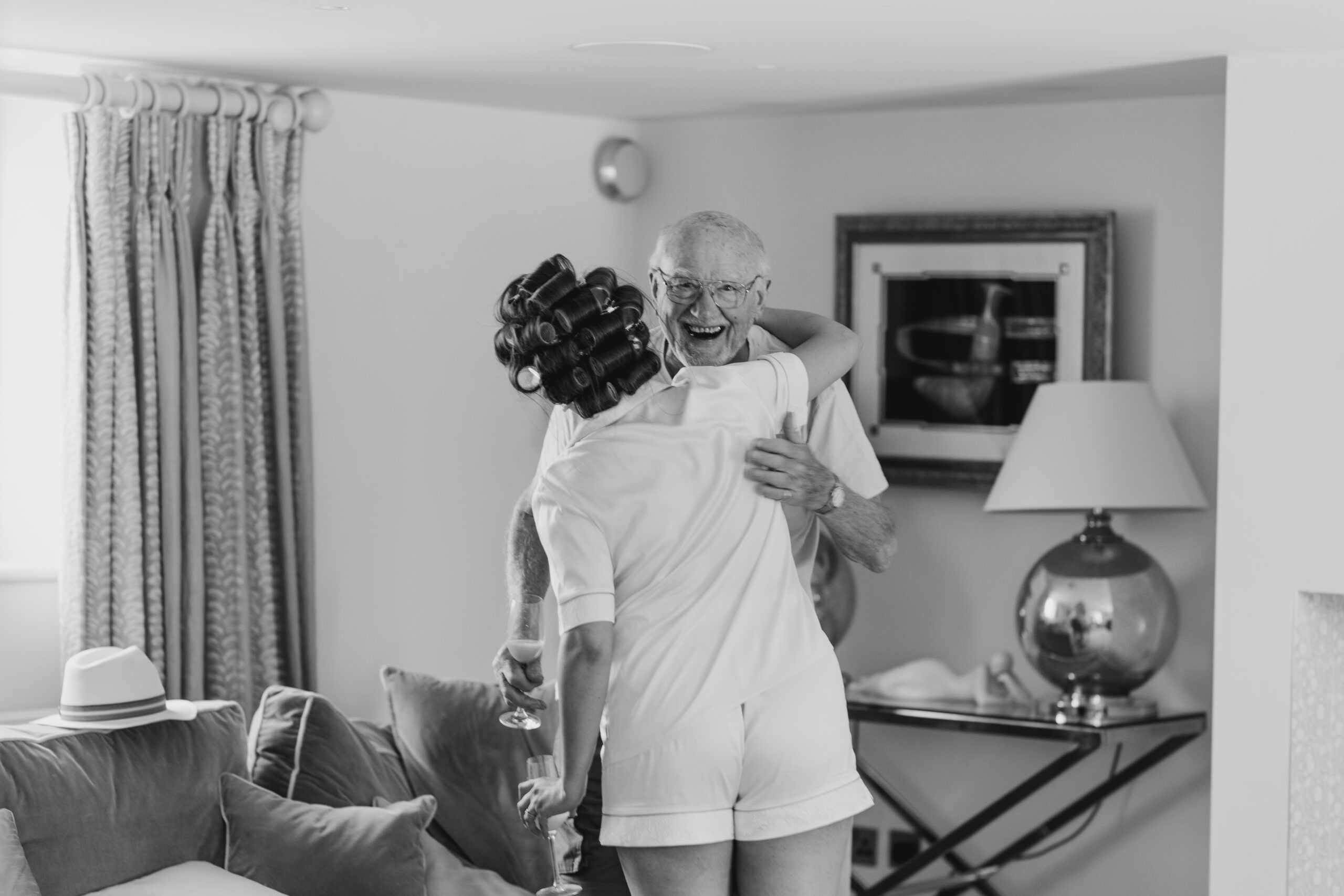 bride greeting grandad, hair in rollers