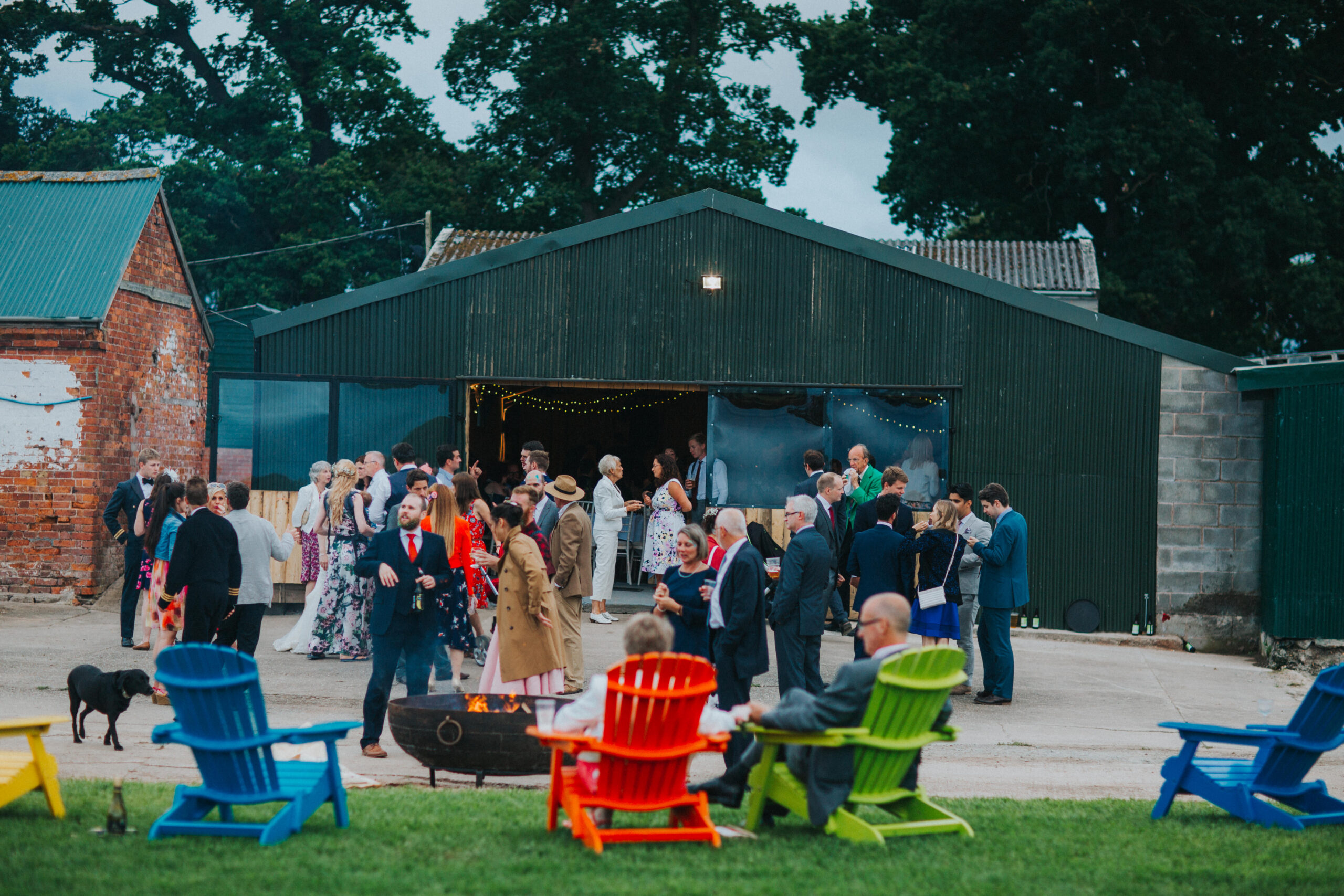 Guests mingling outside the barn