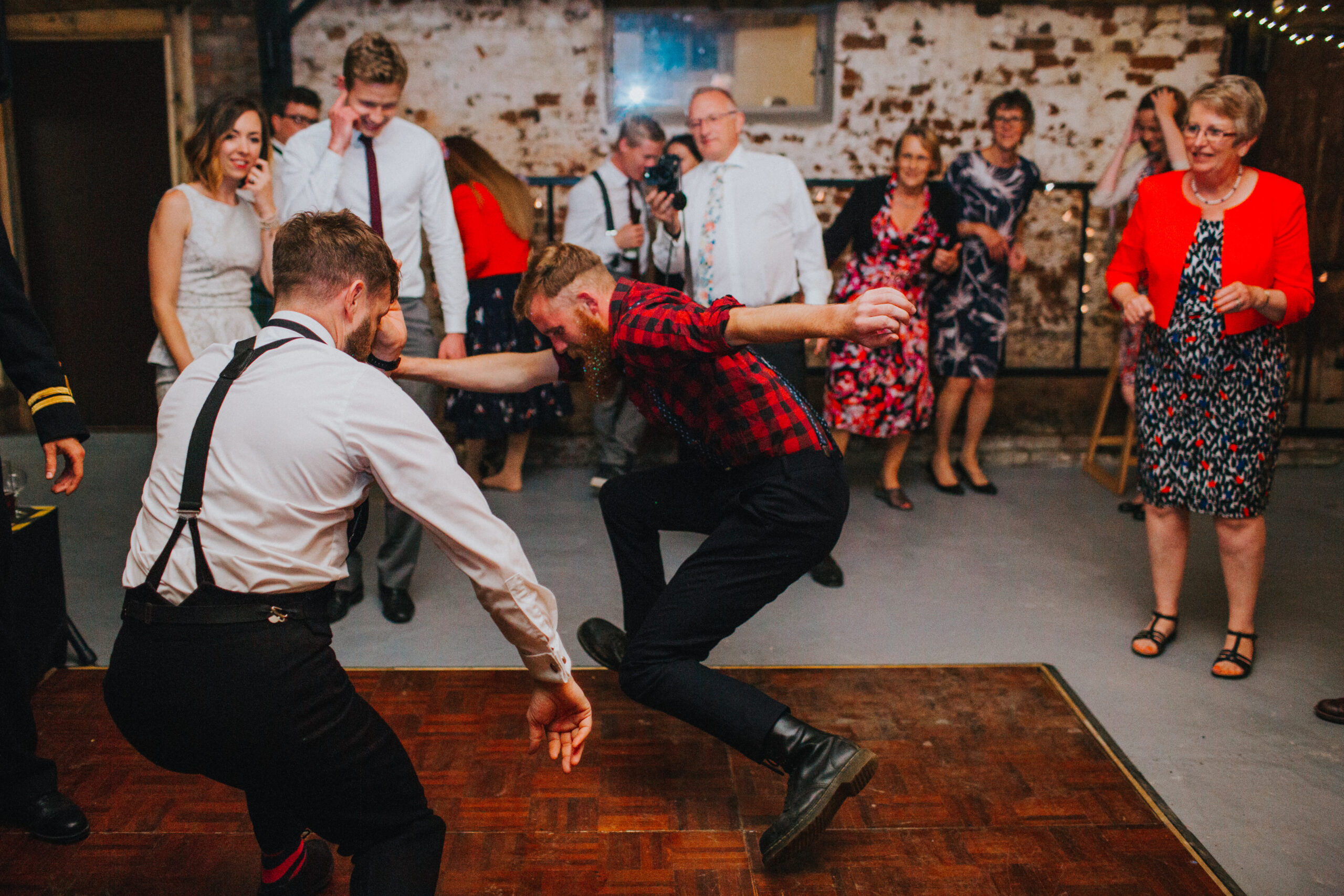 guest dancing with groom