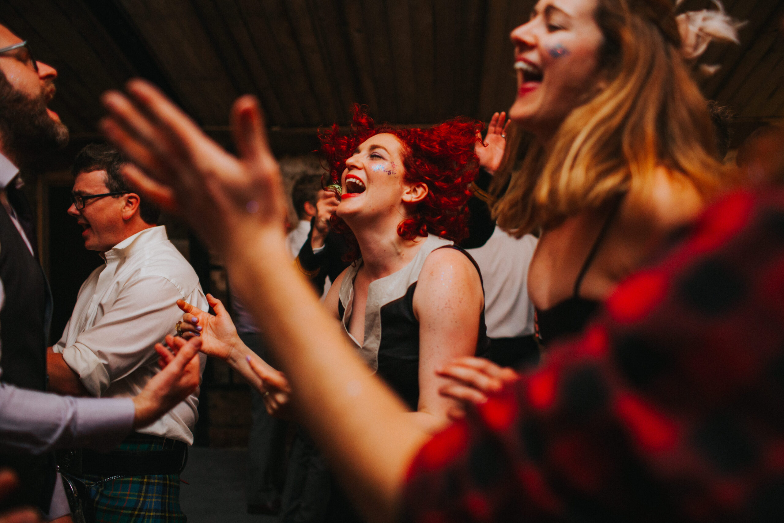 wedding guests dancing and smiling