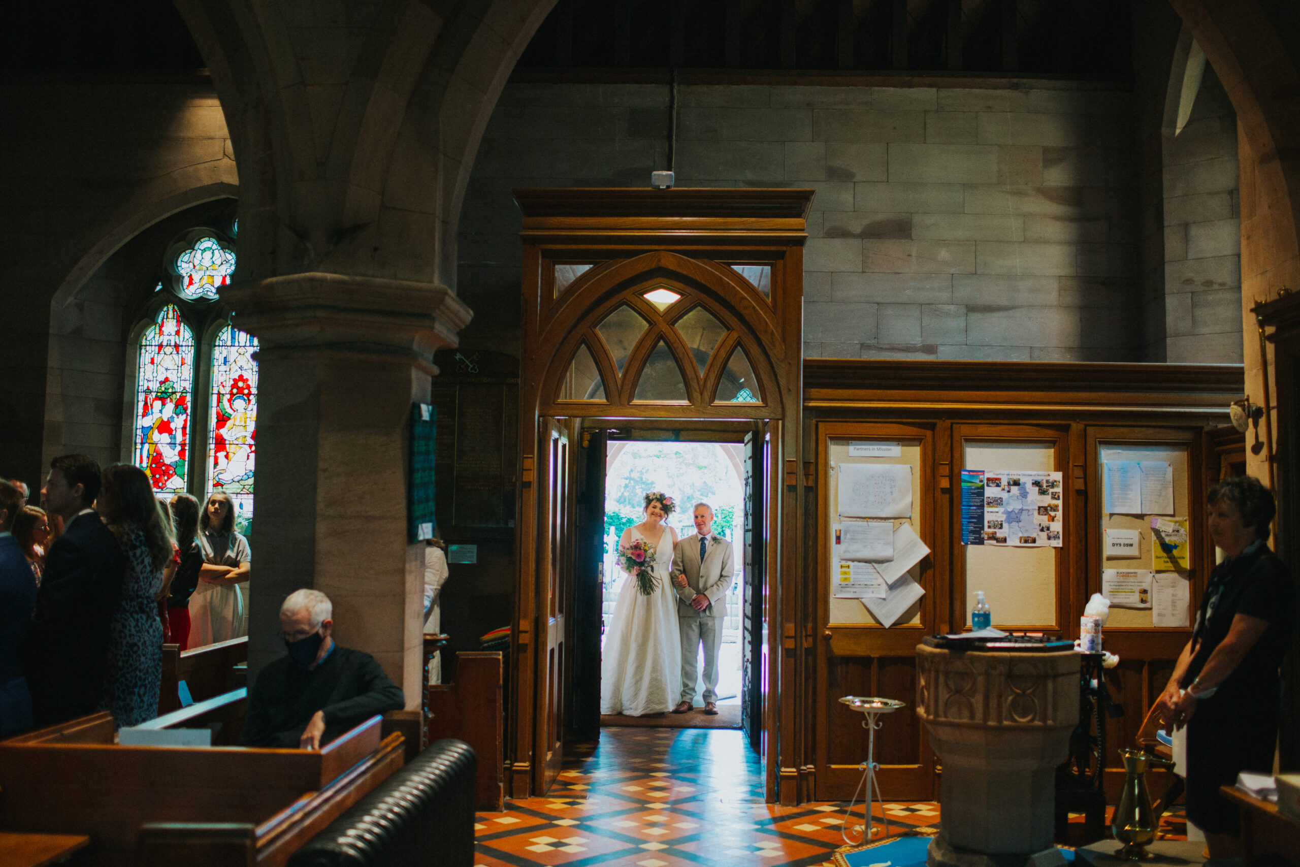 bride and dad in church entrance