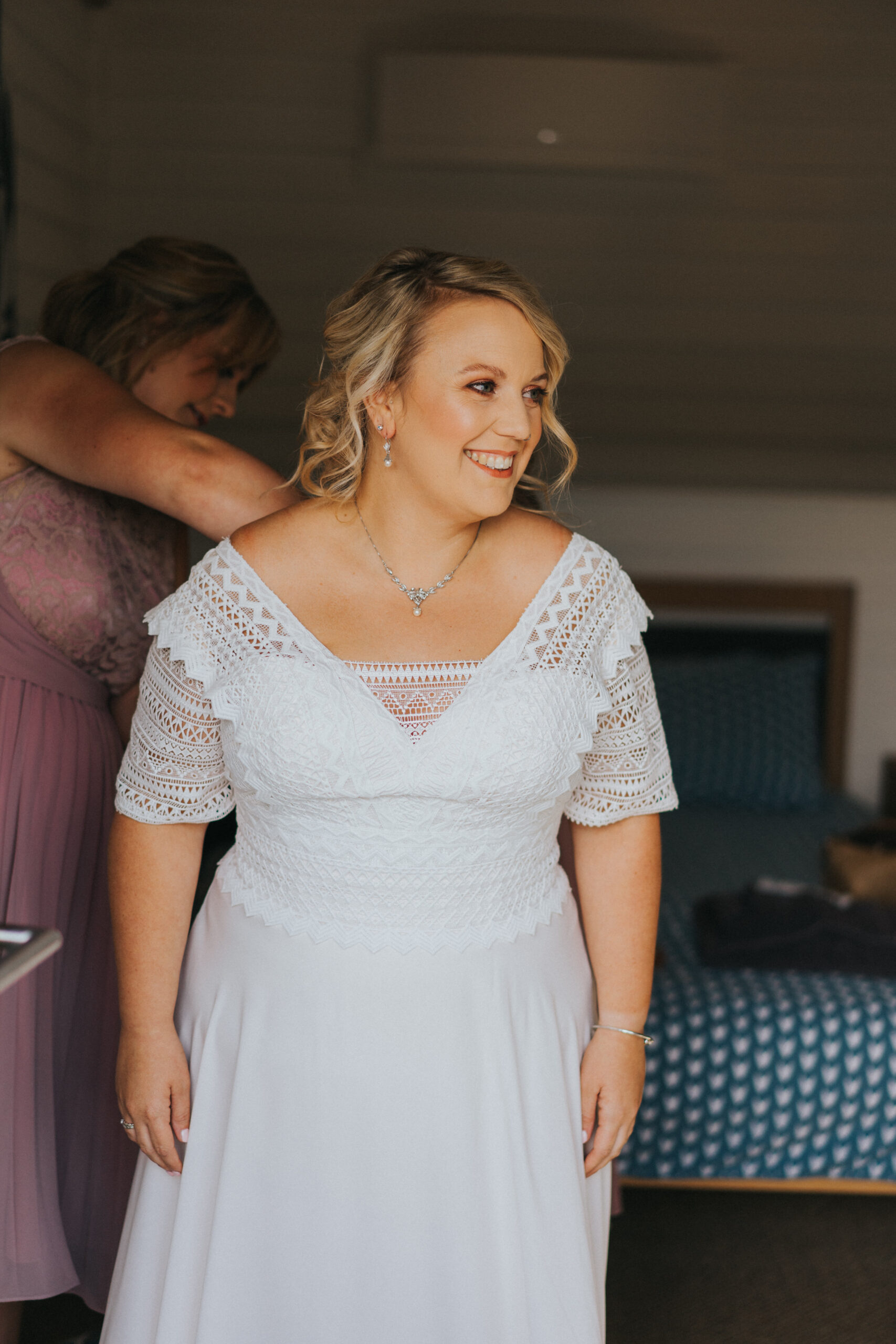 bride's dress being done up