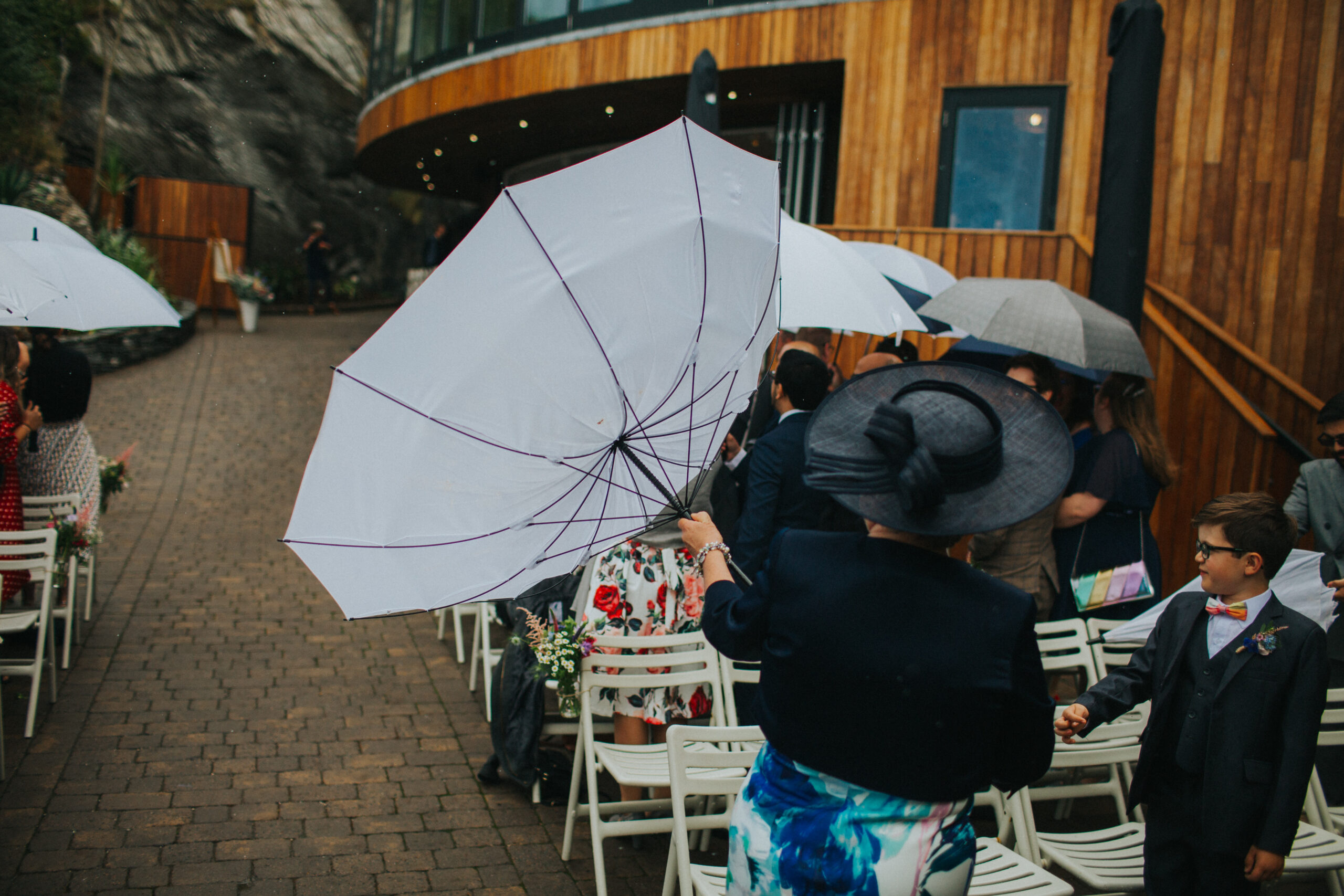 umbrella at rainy wedding