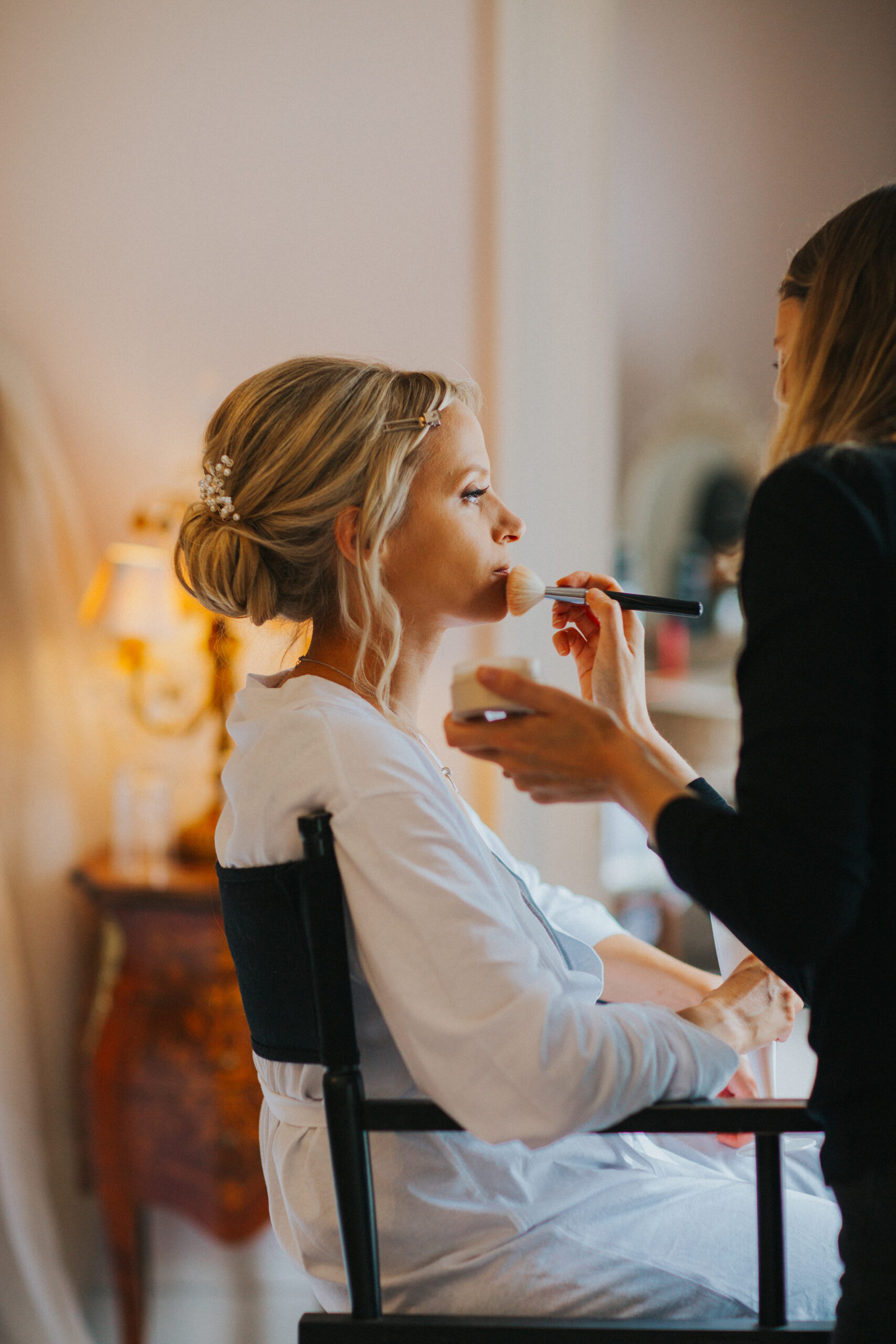 bride having make up done