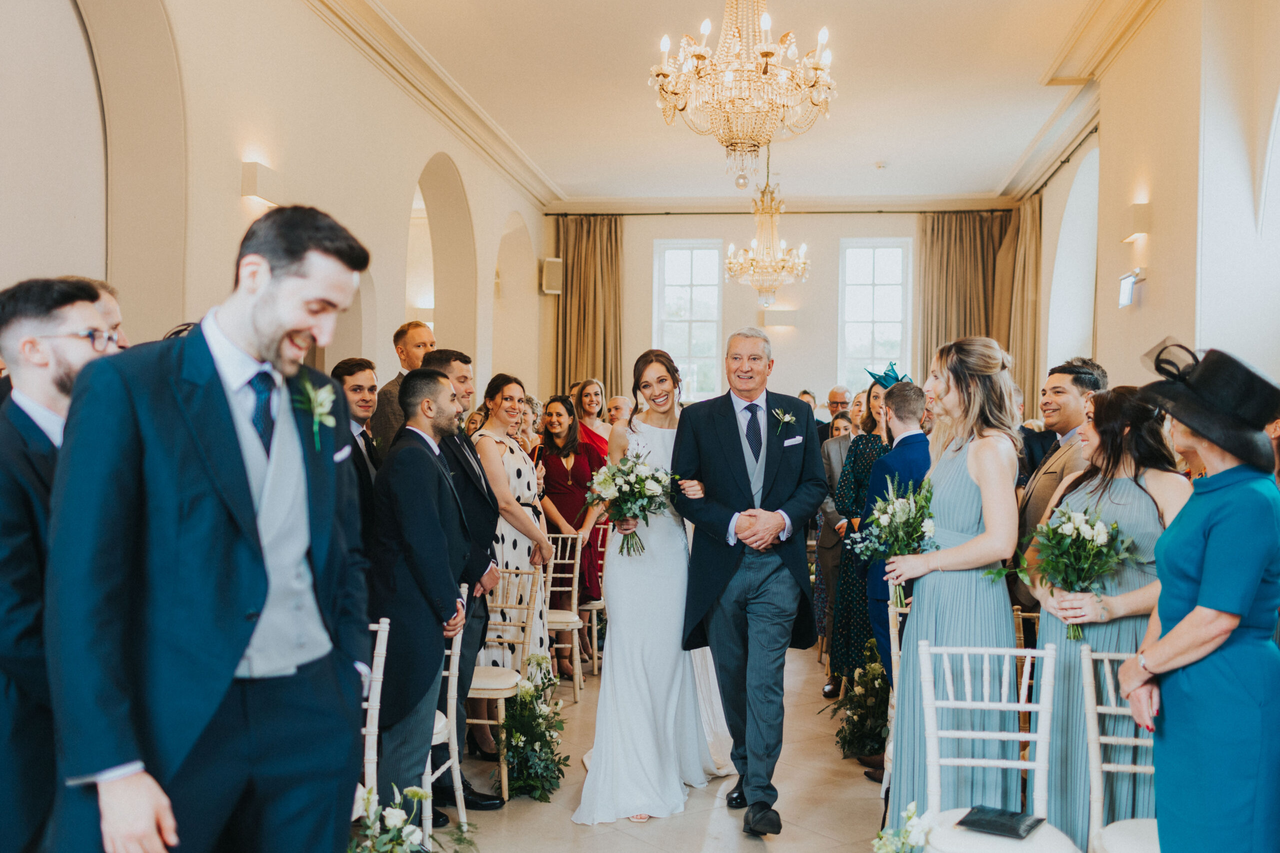 bride walking up the aisle with her dad